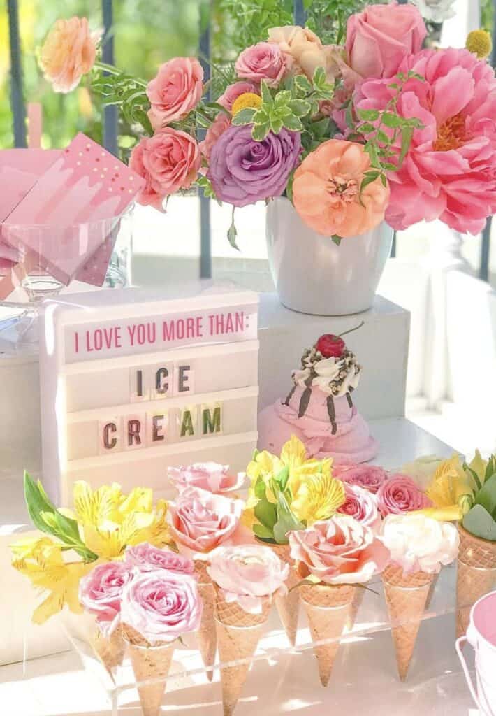 Colorful floral arrangement with pink roses and peonies for celebration.