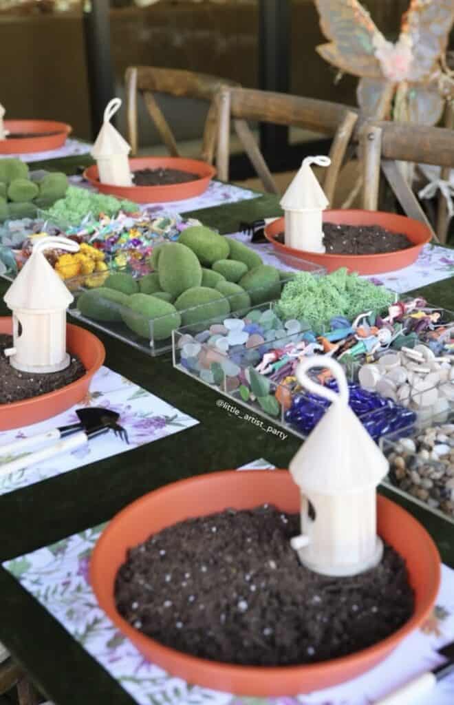 Colorful desert table with themed decorations and candies for a party.