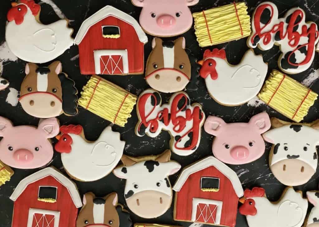 Colorful farm animal and barn themed cookies for baby shower or farm birthday party.