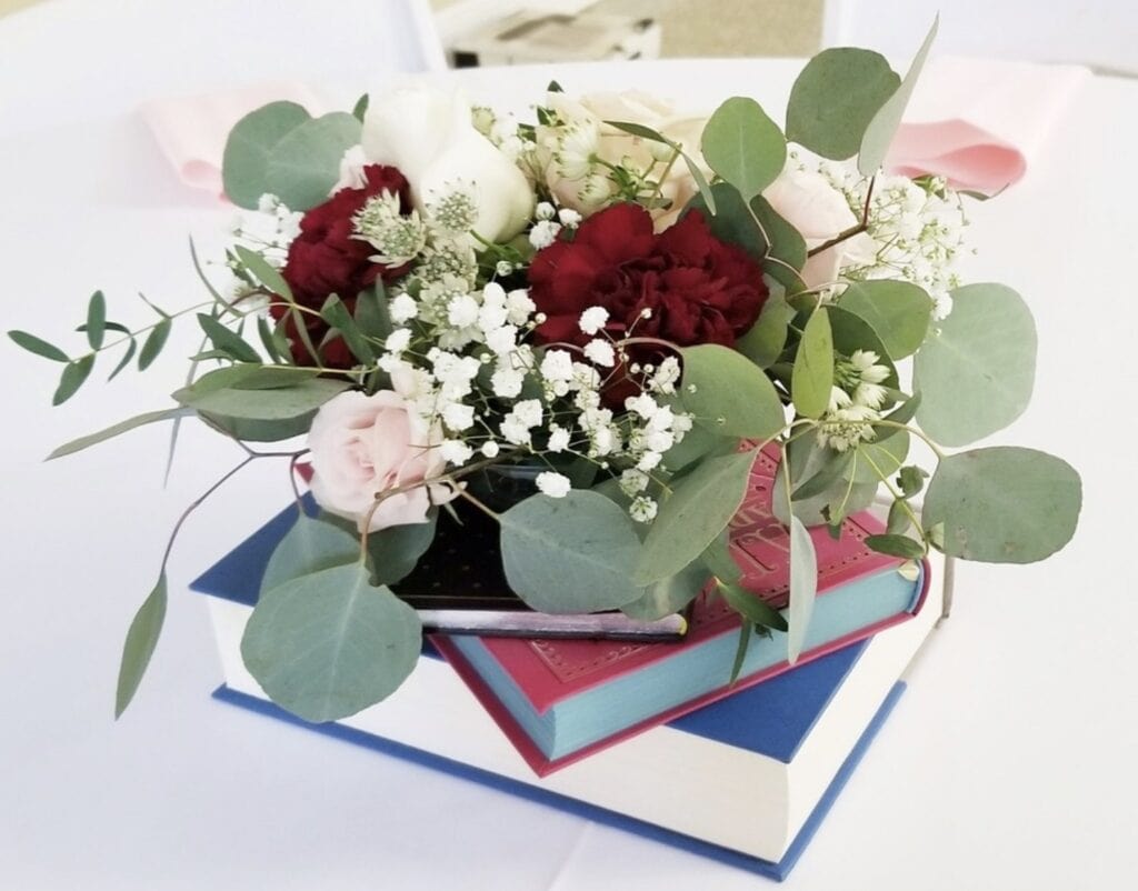 Elegant flower arrangement with roses, hydrangeas, eucalyptus, and baby's breath.