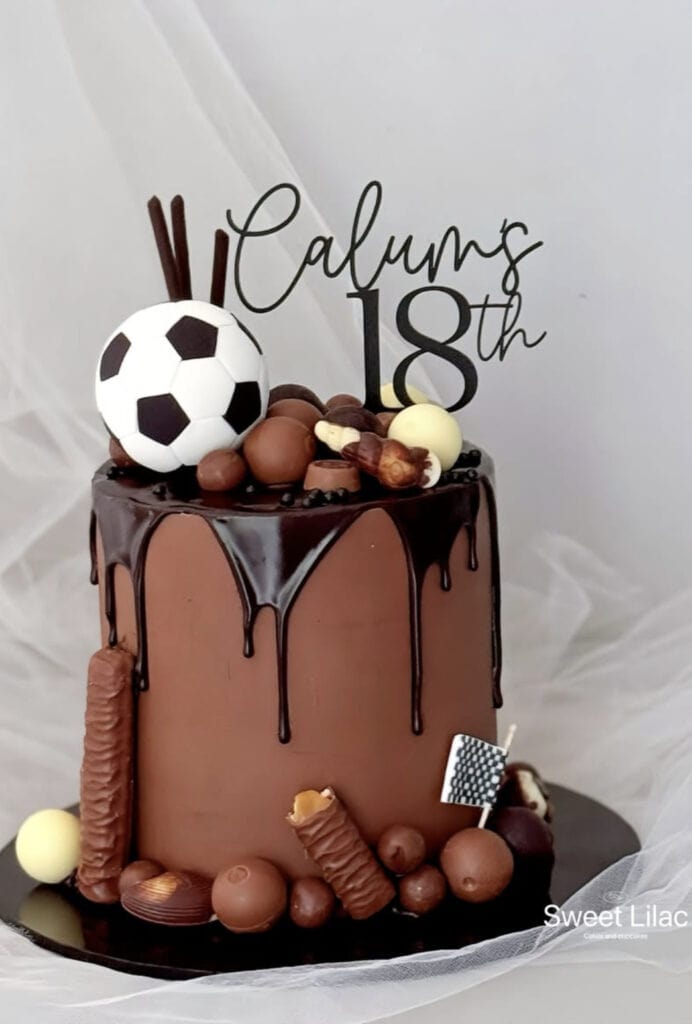 Colorful birthday cake with soccer-themed decorations for 18th celebration.