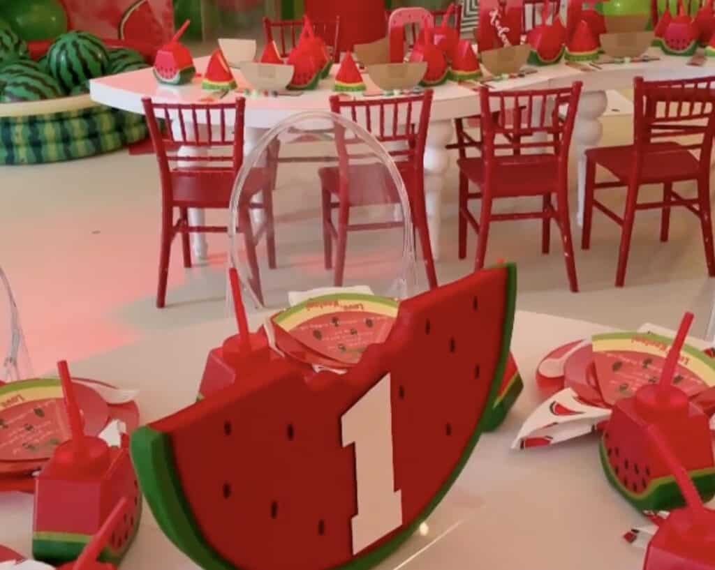 Watermelon-themed party decor and table setting for a festive celebration.