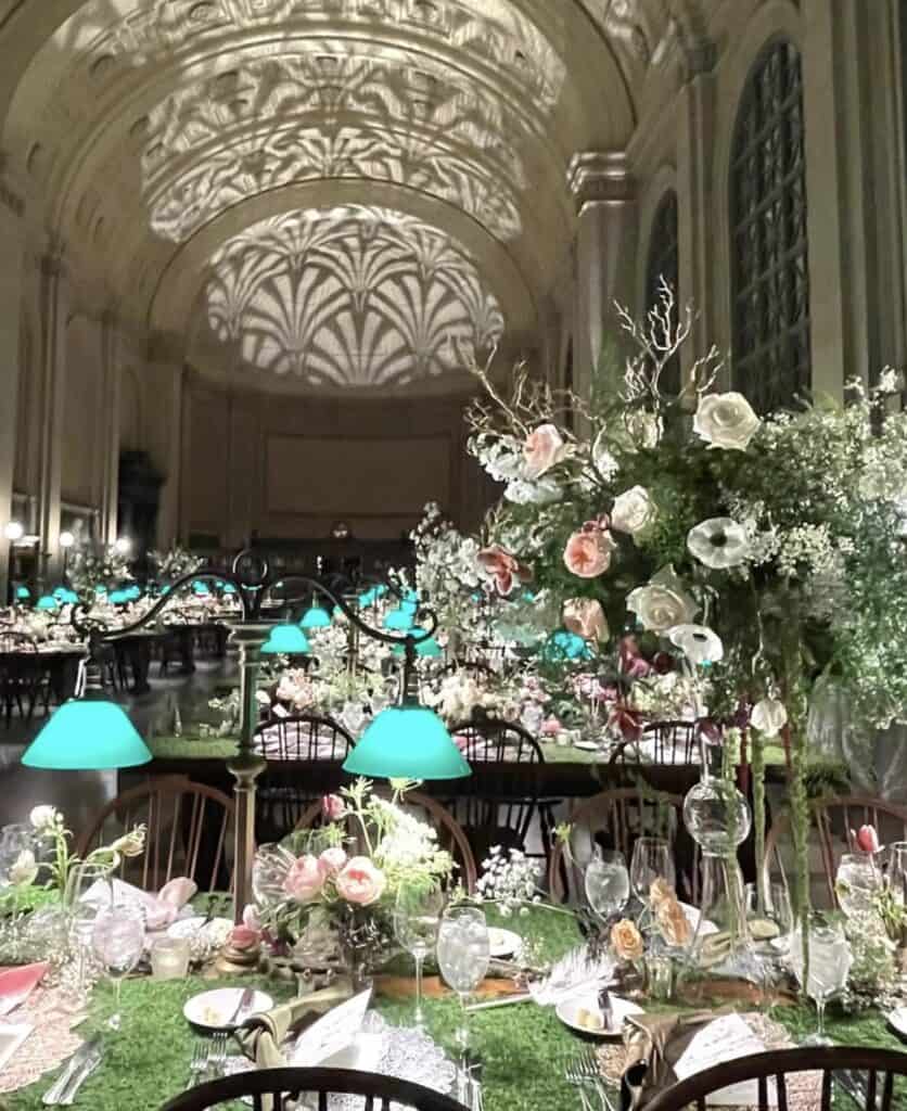 Luxurious wedding reception with floral centerpieces and elegant decor.