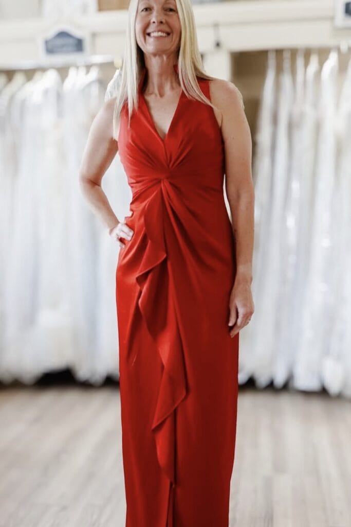Elegant red evening gown with ruffle detail for special occasions.