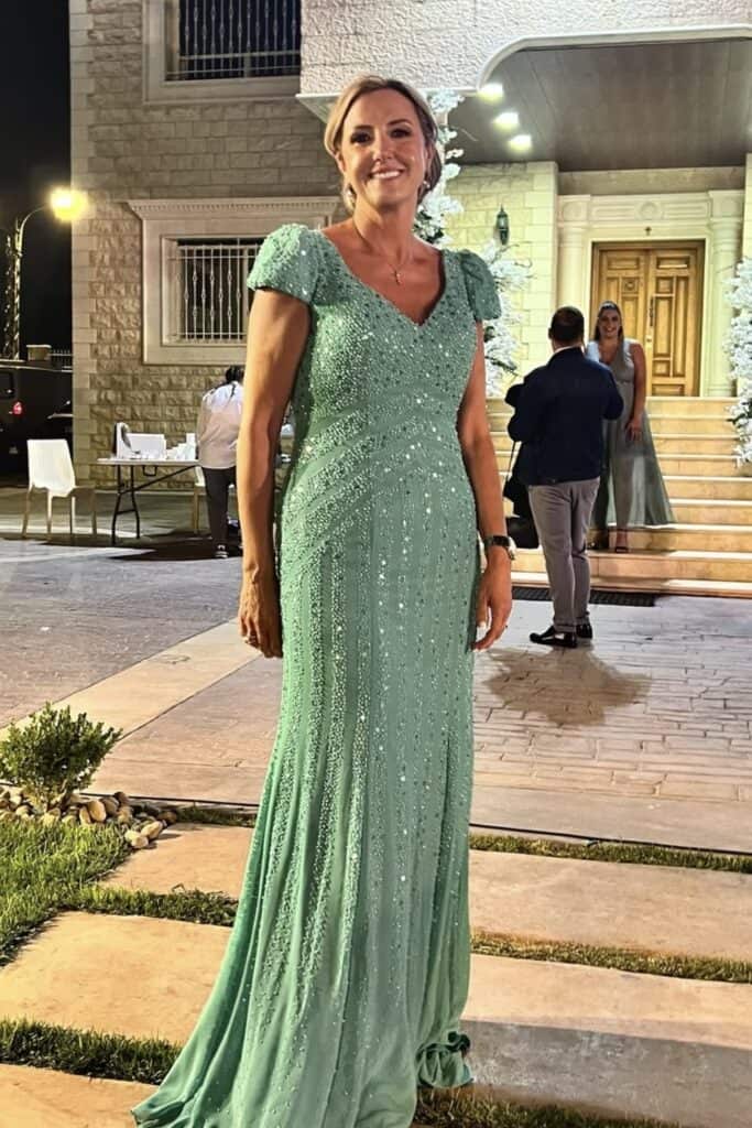 Elegant mint green beaded evening gown for formal event at Confetti & Roses.
