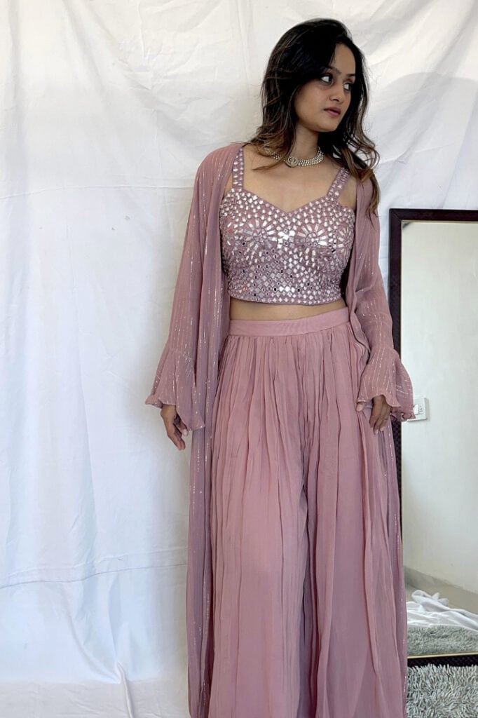 Elegant pink embroidered crop top and wide-leg pants with shimmering pink dupatta.