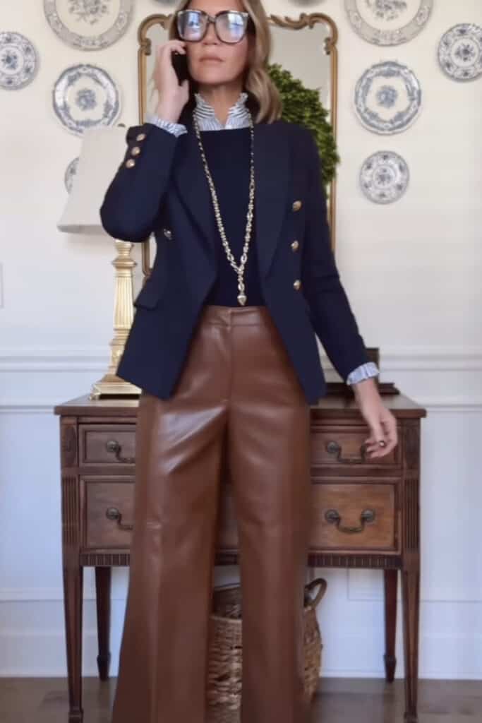 Elegant women fashion with brown leather wide-leg pants and navy blazer.