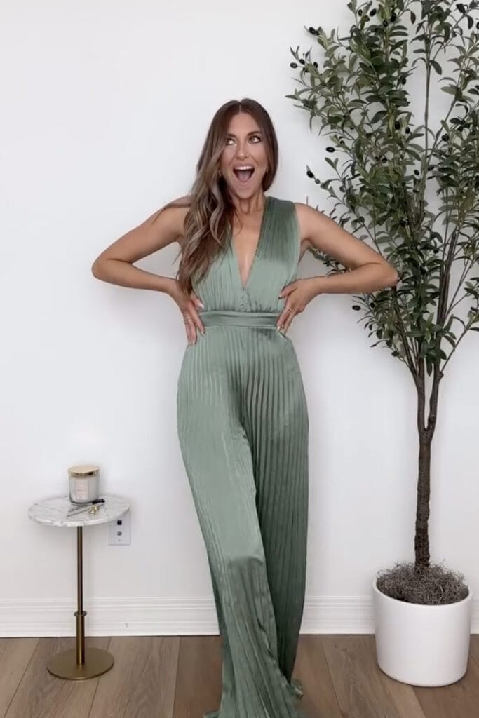 Elegant green pleated jumpsuit for special occasions.