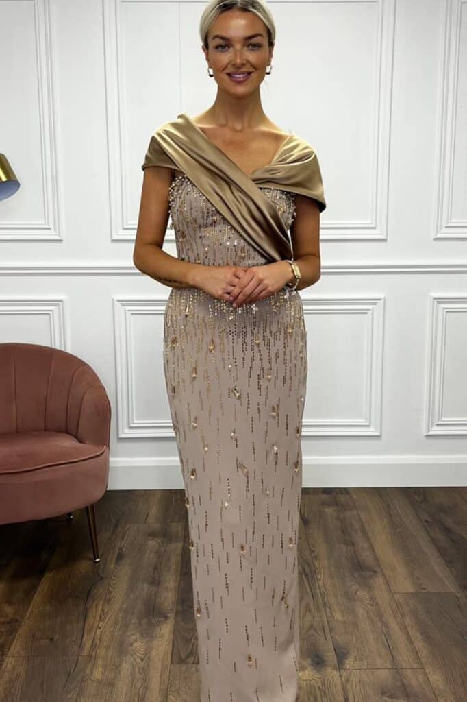 Elegant gold sequin formal evening gown with draped satin shawl.