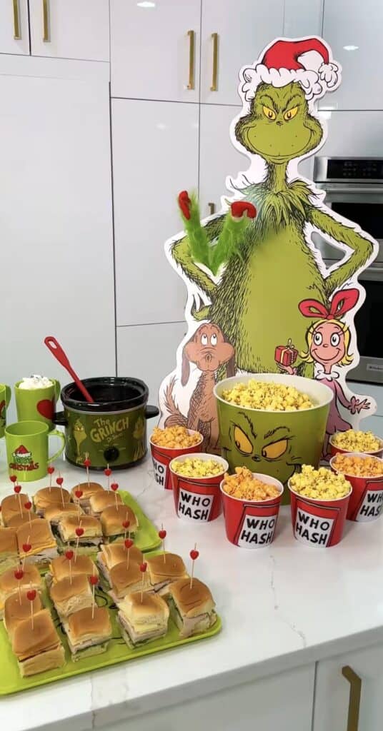 Vibrant Dr. Seuss themed birthday party with Grinch and Whoville decorations.