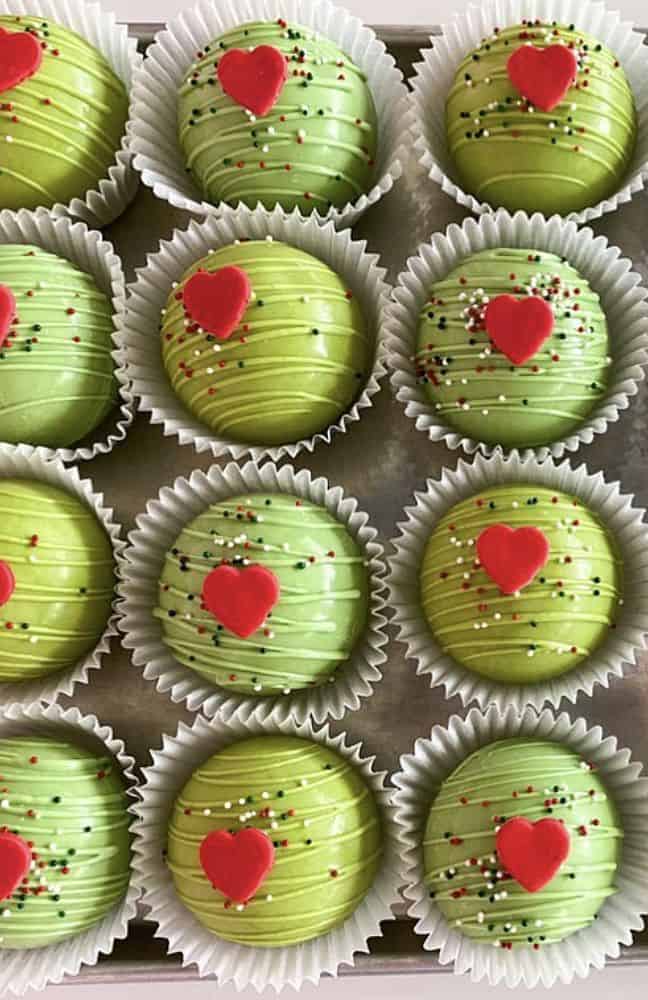 Sweet green heart-shaped Valentine's Day cake balls with sprinkles, decorated for celebration.