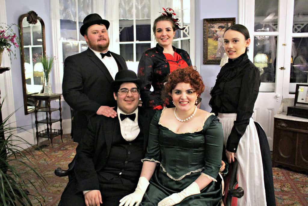 Group of people dressed in vintage Victorian costumes at Confetti & Roses event.