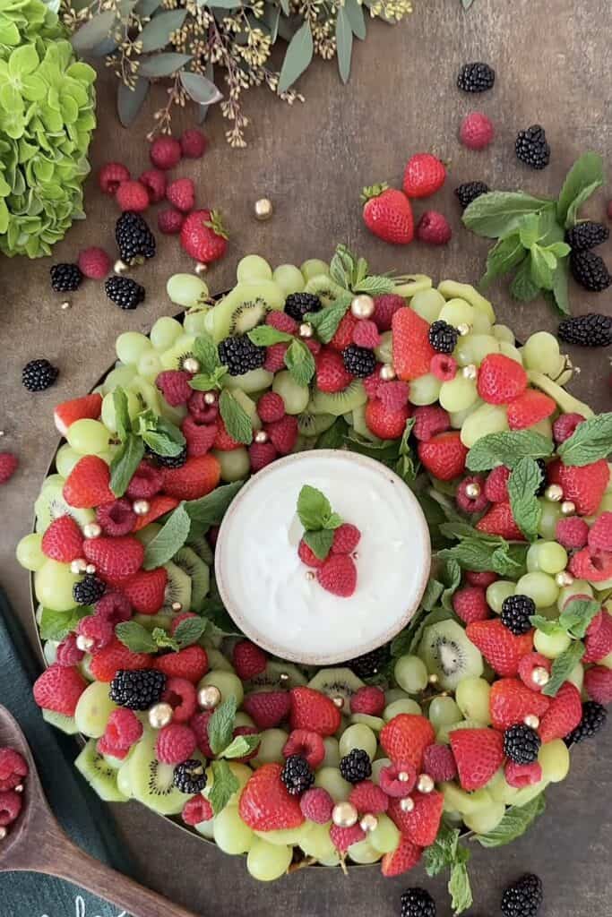 Fresh mixed berries with strawberries, blackberries, raspberries, and green grapes.