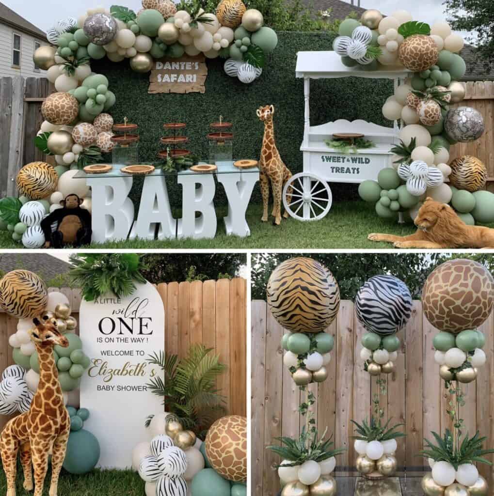 Balloon arch safari theme with greenery and animal prints.