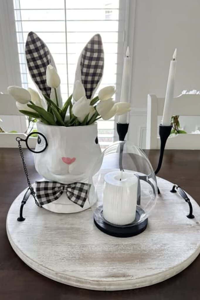 Cheerful bunny-shaped flower vase with white tulips and checkered bunny ears.