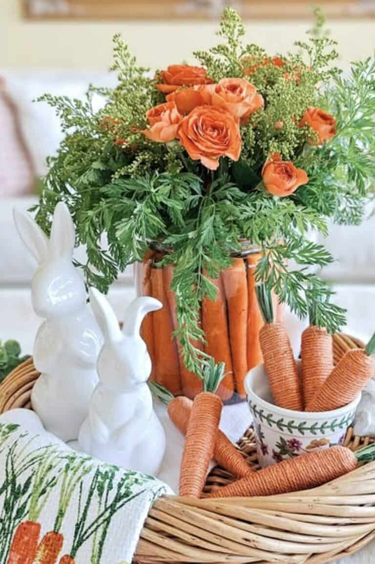 Bright orange roses and fresh greenery in a stylish floral arrangement, spring decor centerpiece.