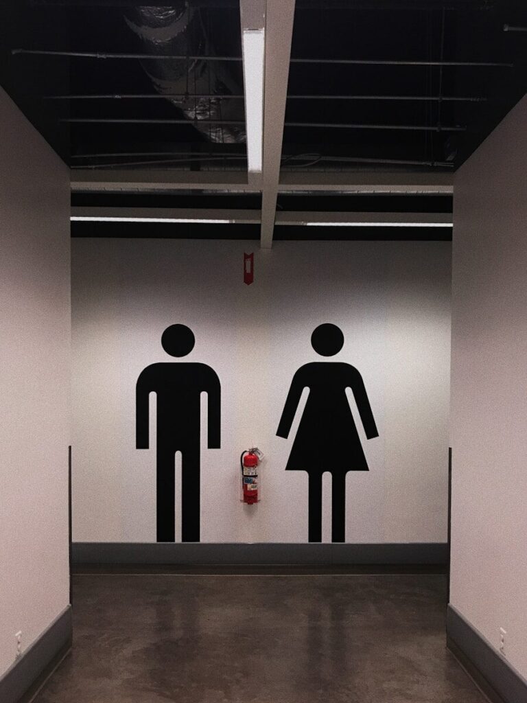 man and woman sign
