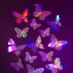 a bunch of butterflies that are glowing in the dark