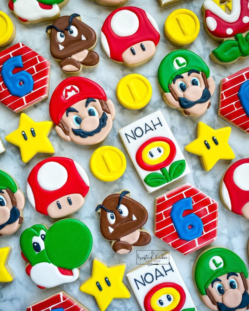 Mario-themed birthday cake decorations with Super Mario characters, stars, and coins for a nostalgic.