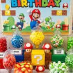 Super Mario themed birthday party with colorful decorations and candy jars.