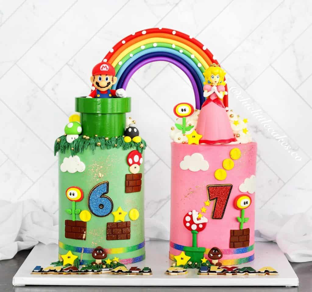 Mario and Princess Peach themed birthday cakes with rainbow decoration, Super Mario elements, and co.