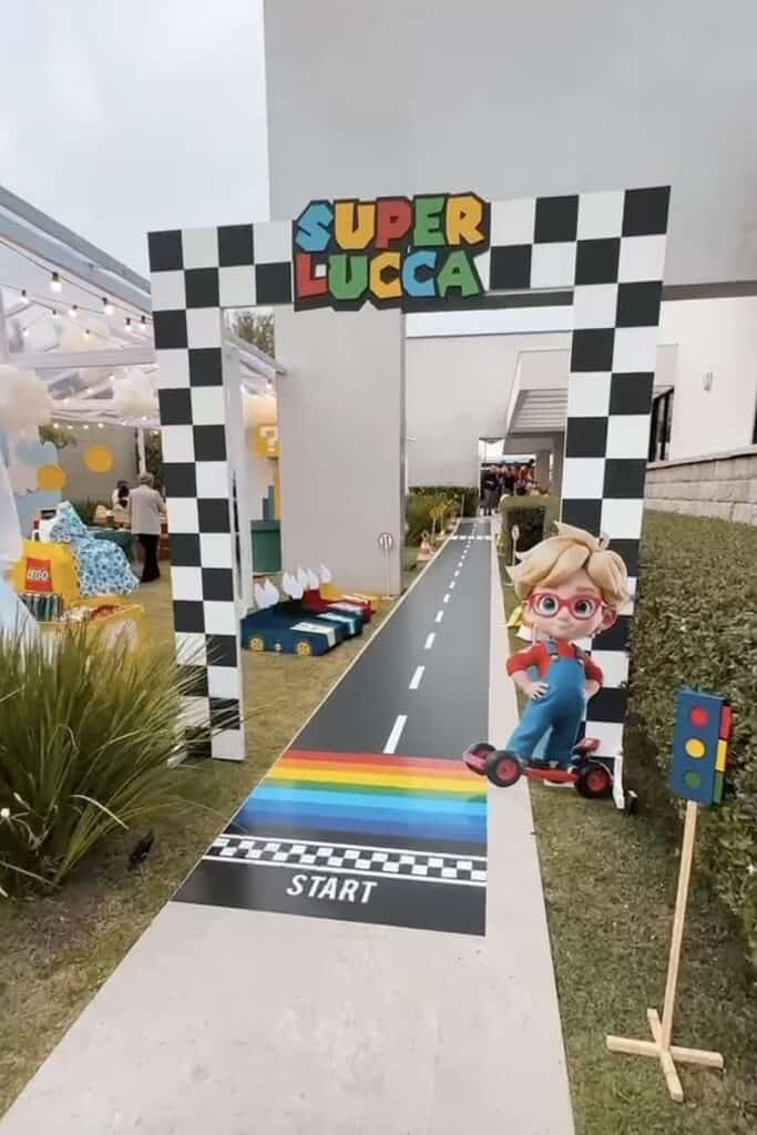 Super Lucca themed race track for children's birthday party, colorful race start arch, playful outdo.
