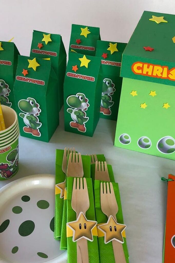 Yoshi-themed party favors and decorations for a birthday celebration.