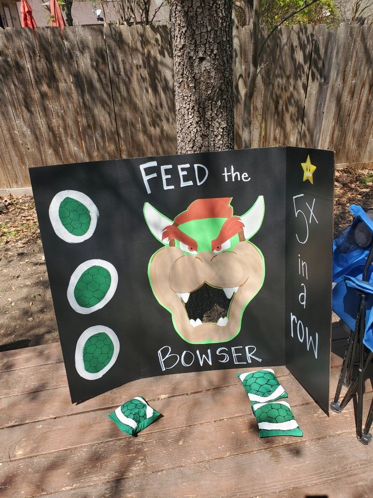 Feed the Bowser game board with green turtle shells for a Mario-themed birthday party.