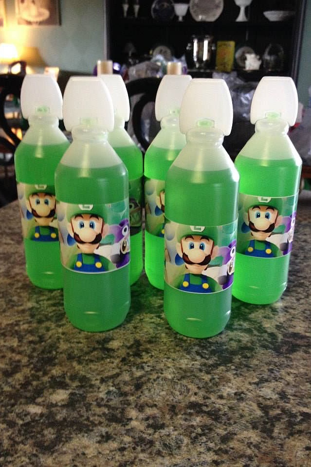 Mario-themed green bubble bottles with white caps for a Luigi's Mansion birthday party.