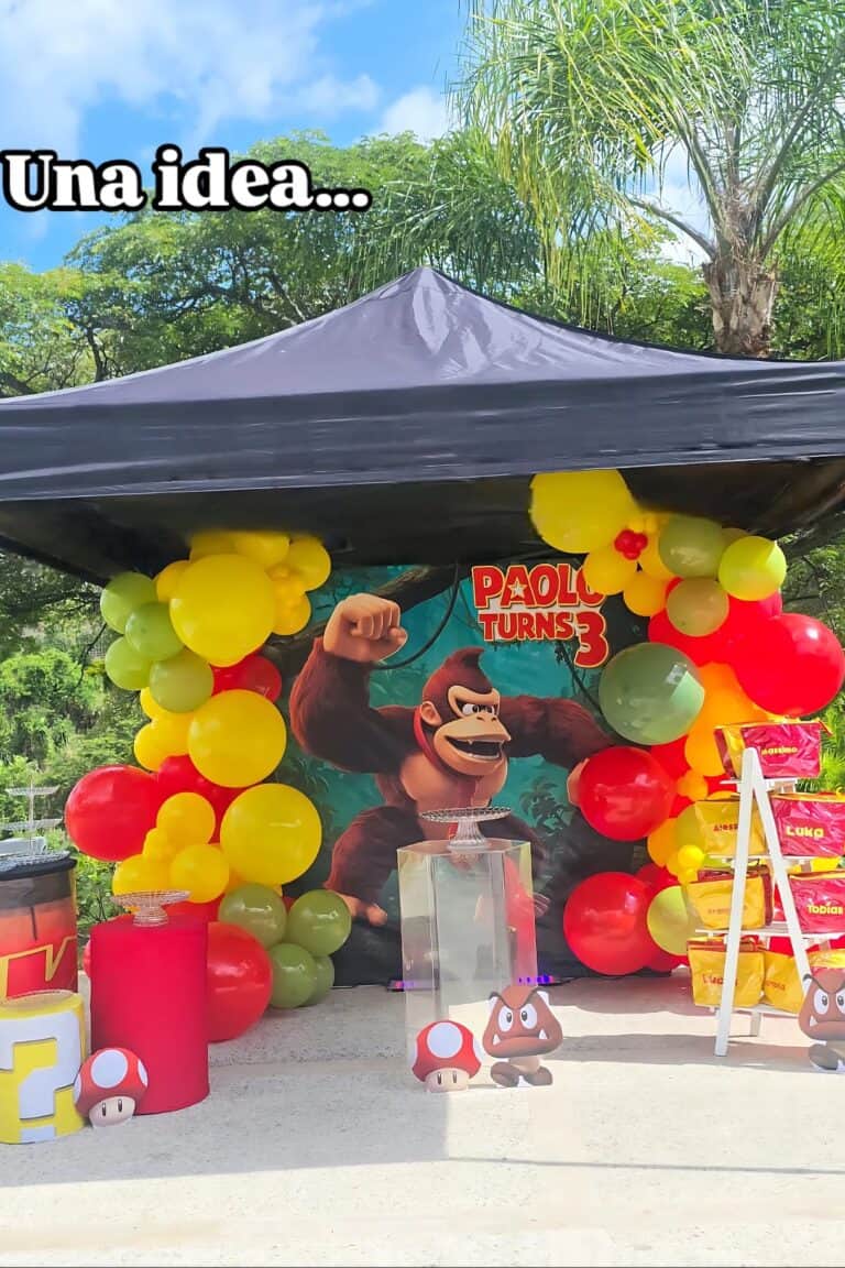A colorful Donkey Kong-themed birthday party setup with balloons, banners, and decorations.