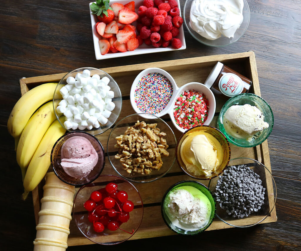 Fresh fruit and toppings for a Donkey Kong-themed birthday party dessert table, colorful and invitin.