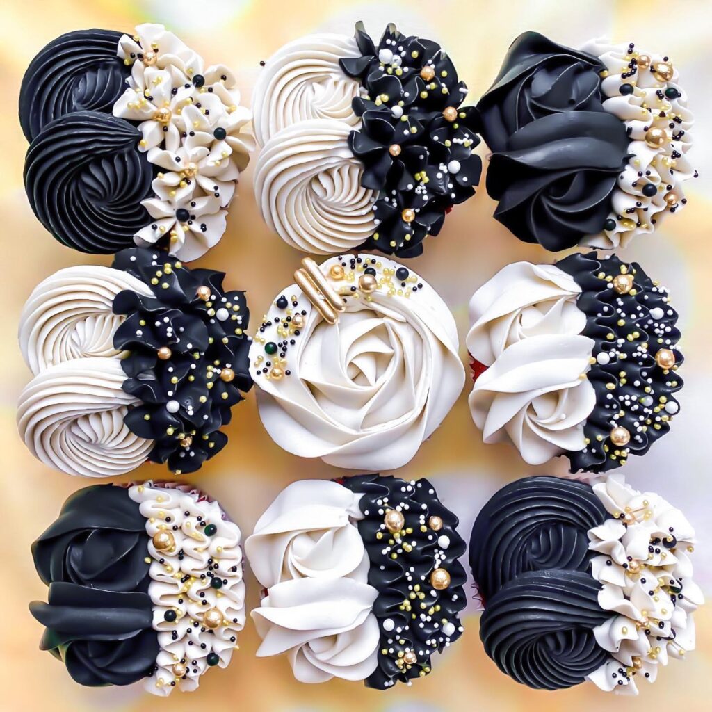 Elegant wedding cupcakes with black, white, and gold decorations for a wedding celebration.