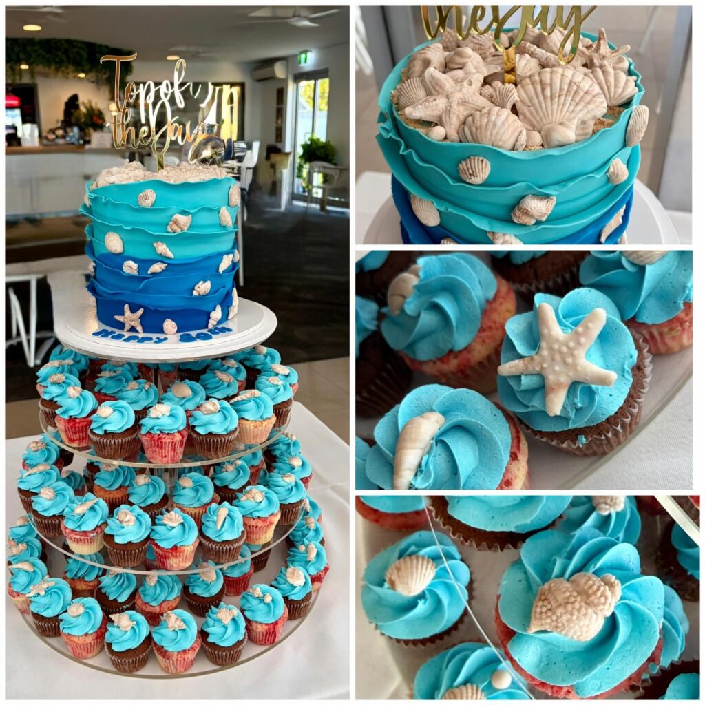 Beautiful ocean-themed wedding cupcakes with blue frosting and seashell decorations.