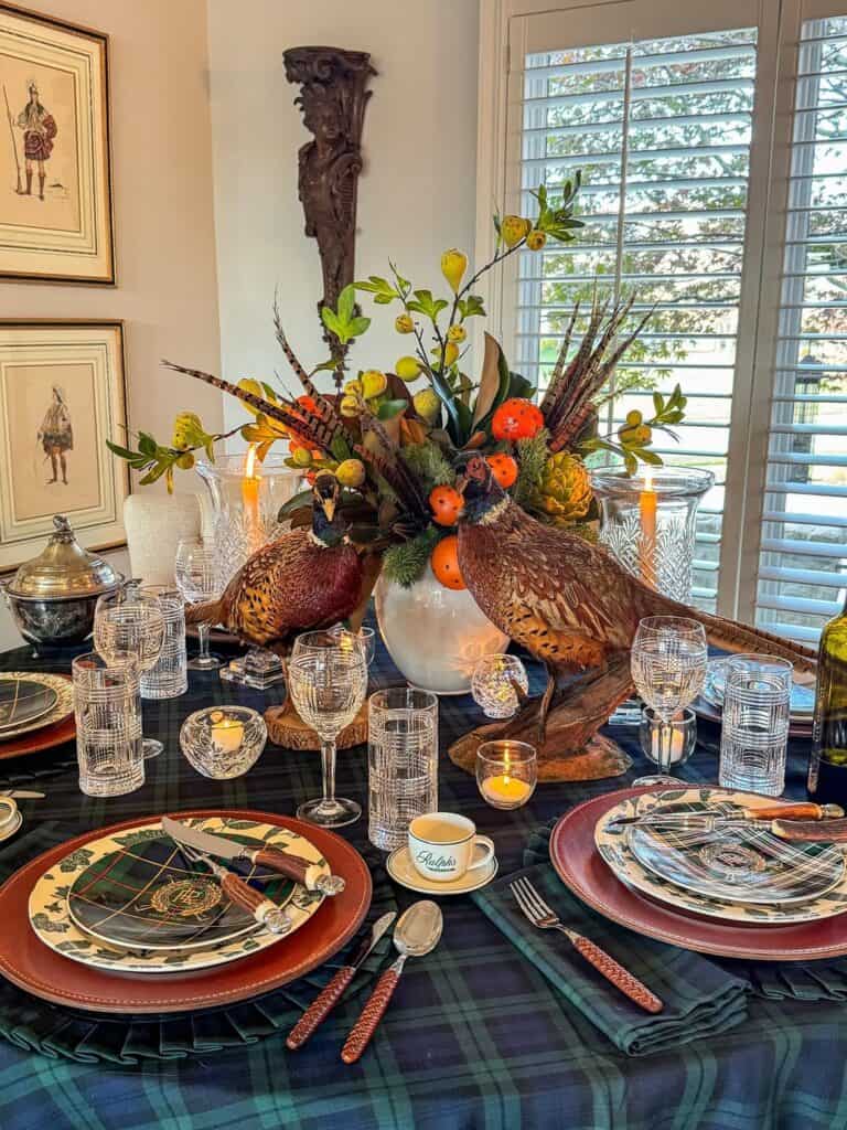 Elegant Thanksgiving tablescape with autumnal floral centerpiece and vintage tableware.