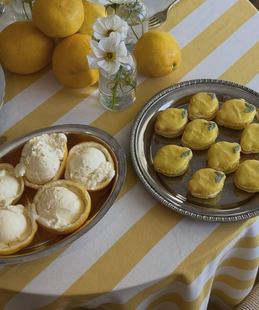Lemon-themed dessert table with lemon curd-filled pastries and lemon ice cream.